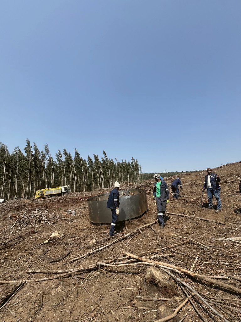Crew setting up kilns on a harvested compartment