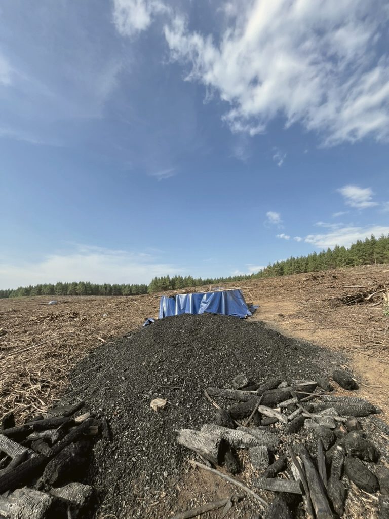 Biochar pile on the compartment, ready for incorporation